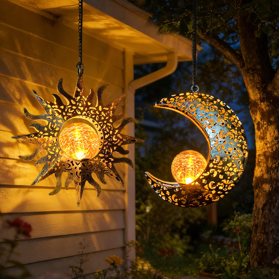 QCF solar hanging sun and moon lantern on a tree for cozy outdoor ambiance.