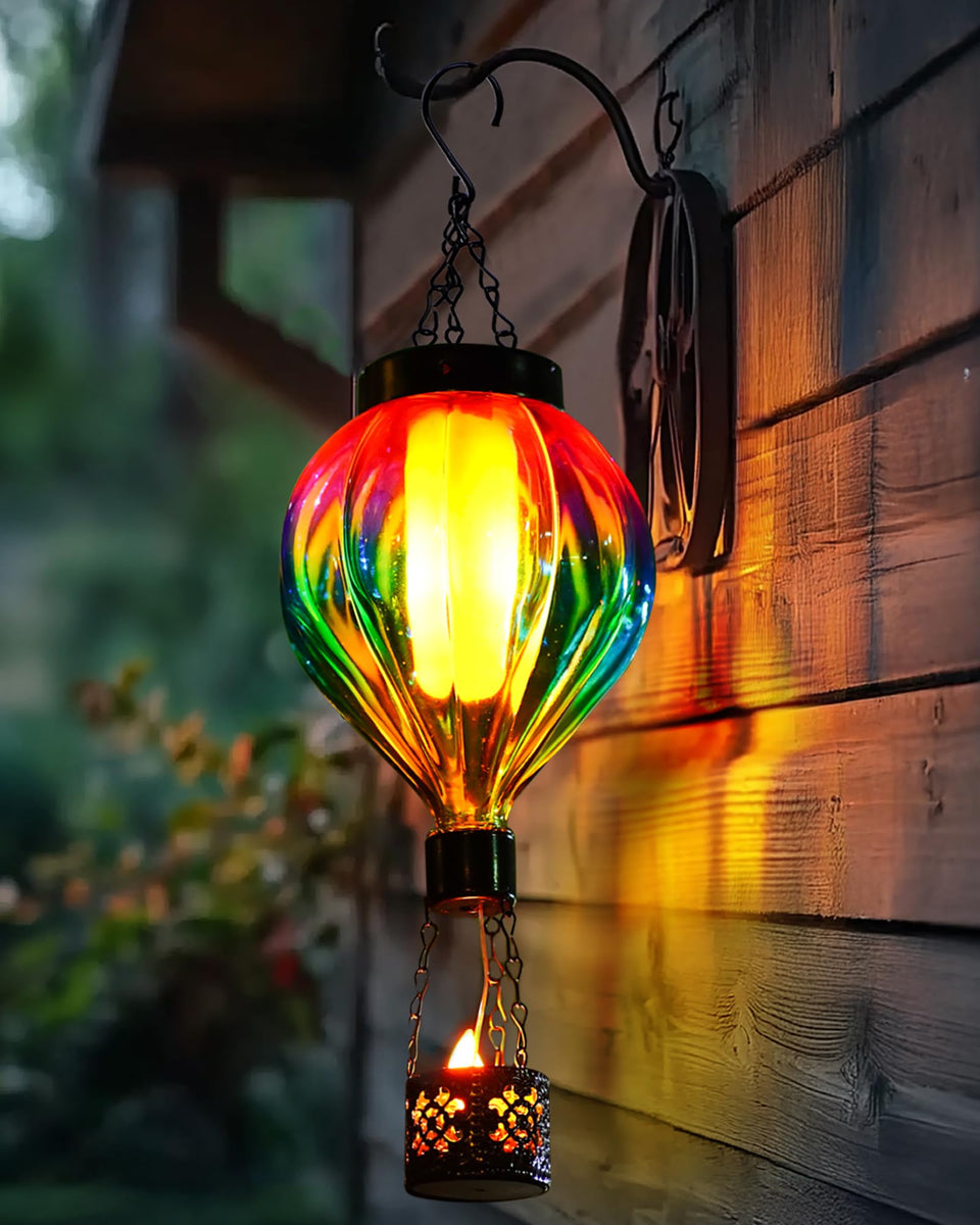 QeemTaco hot air balloon lantern glows at sunrise for porch ambiance.