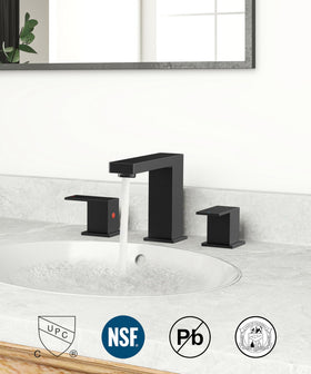 QFN drain pop-up in matte black matching faucet finish.