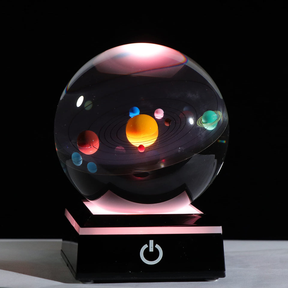 Qianwei 3D Solar System Crystal Ball on a desk showing planet detail with depth