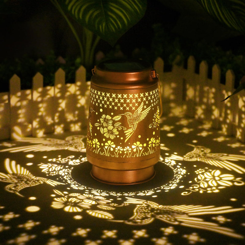 QPPDER hummingbird solar lantern glows softly for outdoor ambience