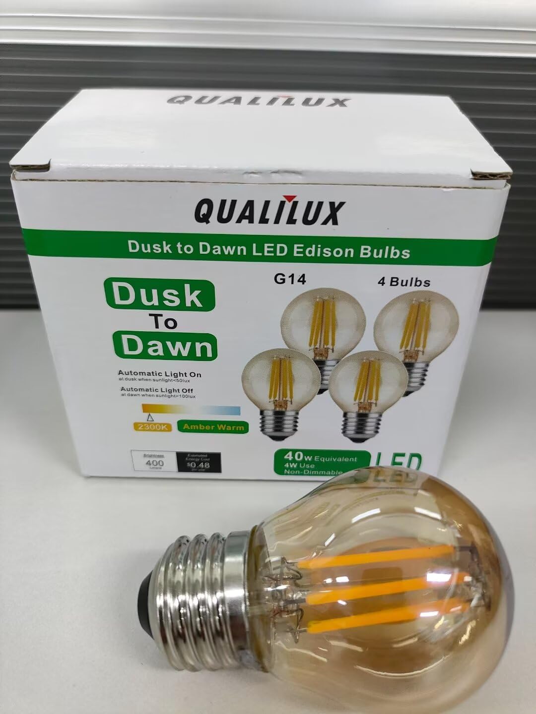 Qualilux amber glass bulb enhances porch ambience with warm light.