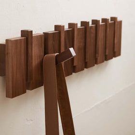 QUELLANCE piano-keys design coat hooks add decorative storage and tidiness.