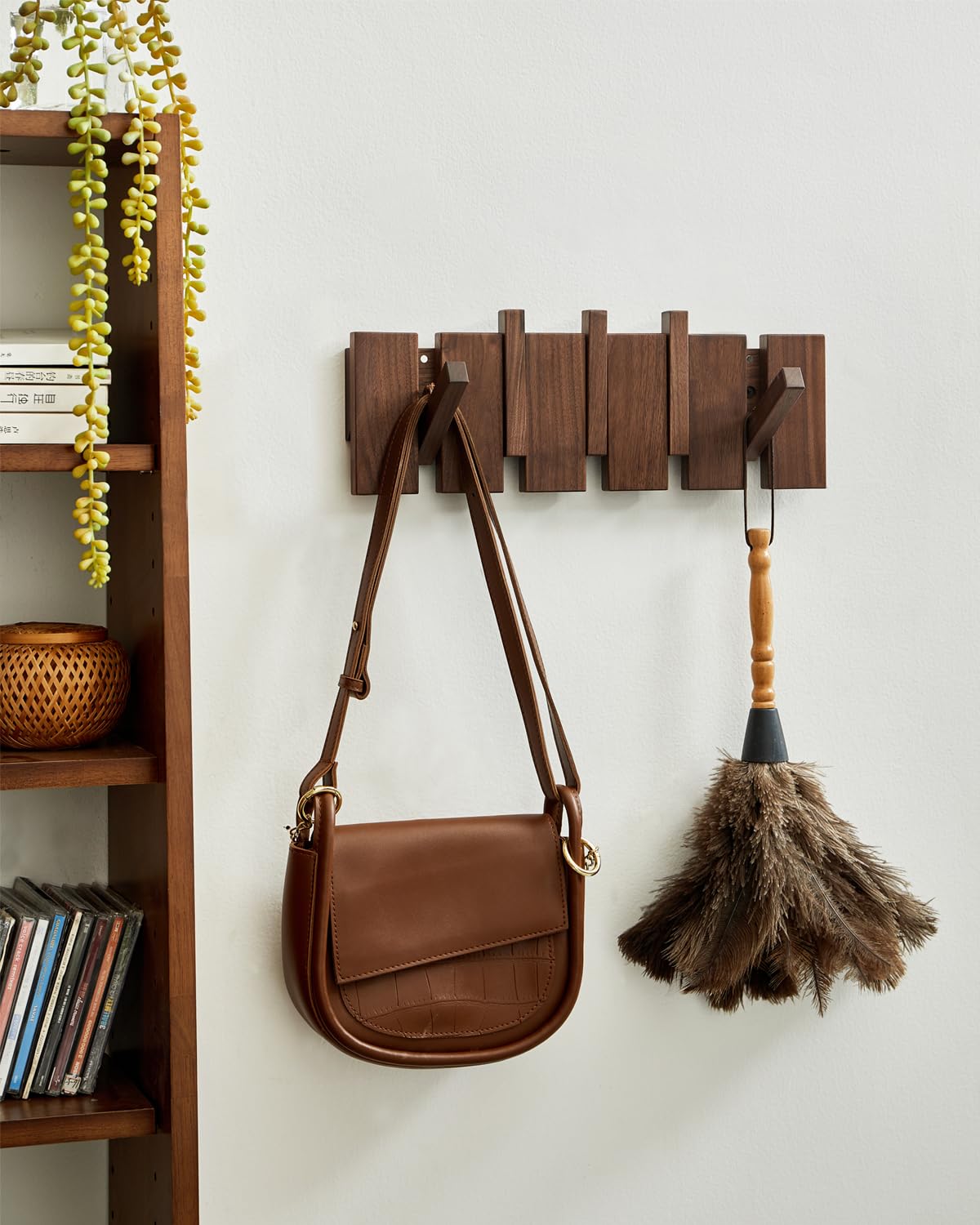 QUELLANCE walnut wood wall rack showing piano-key design and sturdy hooks