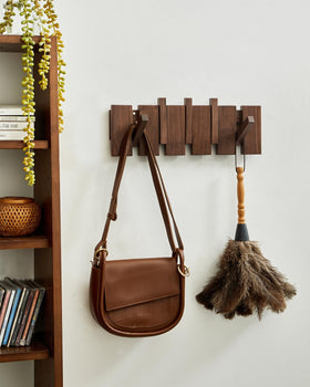 QUELLANCE walnut wood wall rack showing piano-key design and sturdy hooks