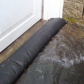 Quick Dam 5 ft flood barriers expanding on contact for immediate water diversion.