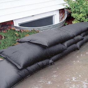 Quick Dam flood bags swell when wet to absorb water.
