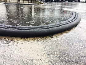 Quick Dam kit absorbs and diverts water without sand or heavy labor.