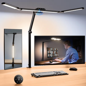 Quntis architect desk lamp with extended side bars lighting a wide workspace.