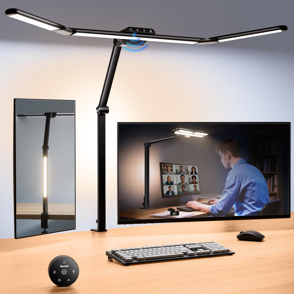 Quntis architect desk lamp with extended side bars lighting a wide workspace.