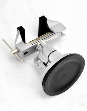 QWORK vacuum base vise with rubber jaws protects delicate items during clamping.