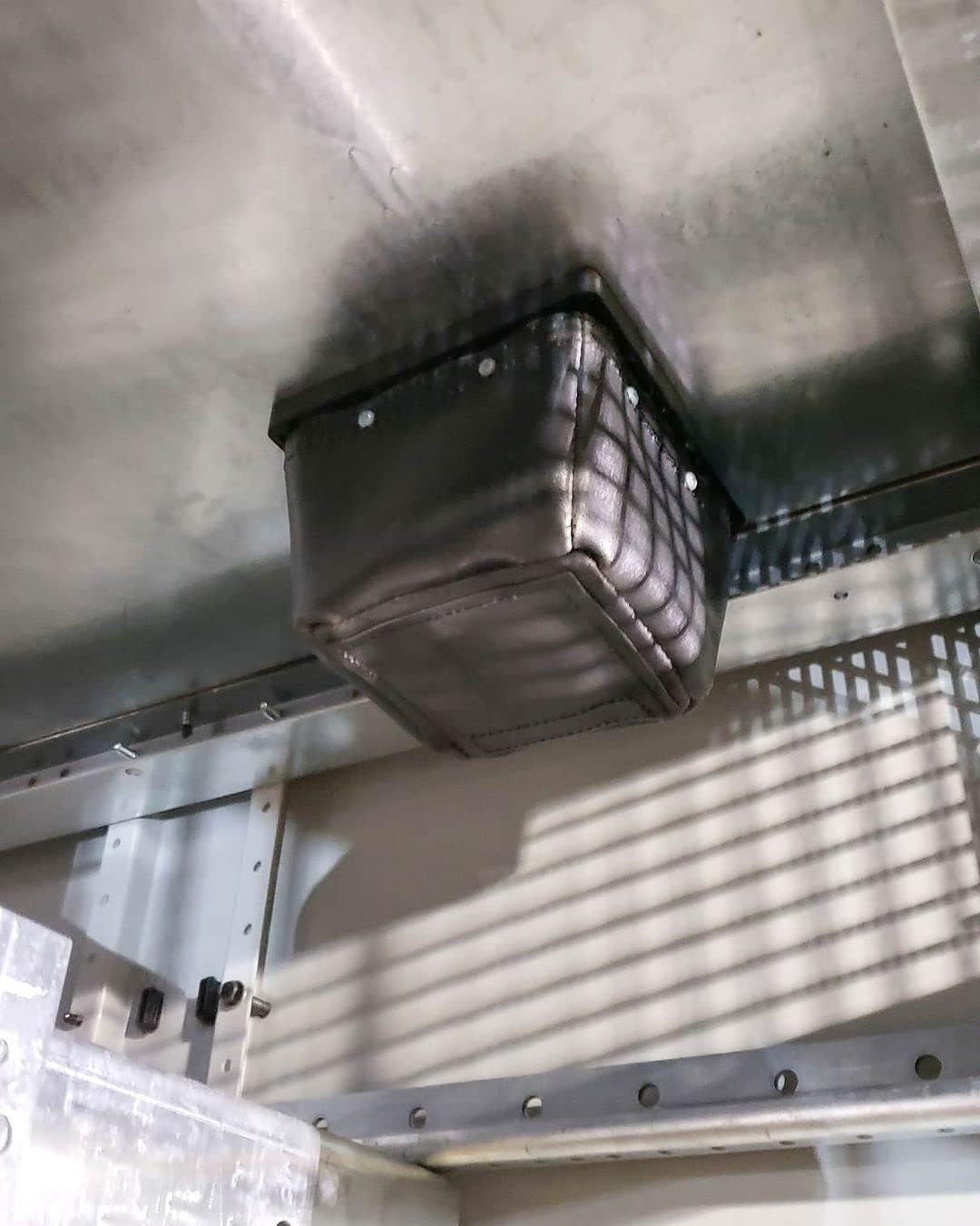Rack-A-Tiers Dirt Bag magnetic-attachment demonstrates secure catch during metal shaving collection
