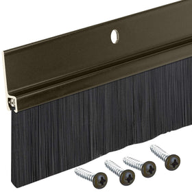 Randall Brown aluminum brush door sweep installed on exterior door seals large gaps and dust.