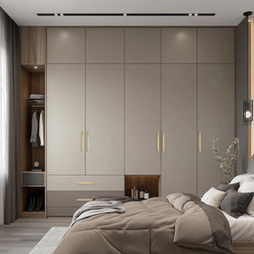 Ravinte champagne bronze finish complements nickel appliances in modern kitchens.