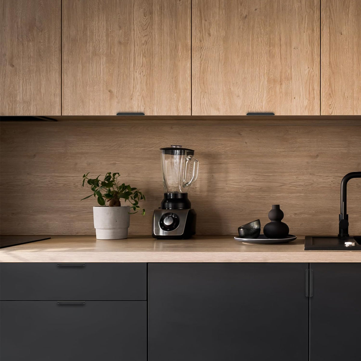 Ravinte black finger pulls on cabinet doors shown in use