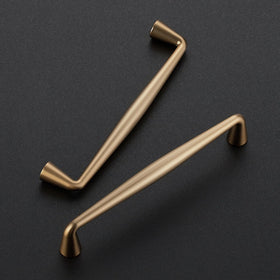 Ravinte champagne bronze pull on a drawer for smooth access.