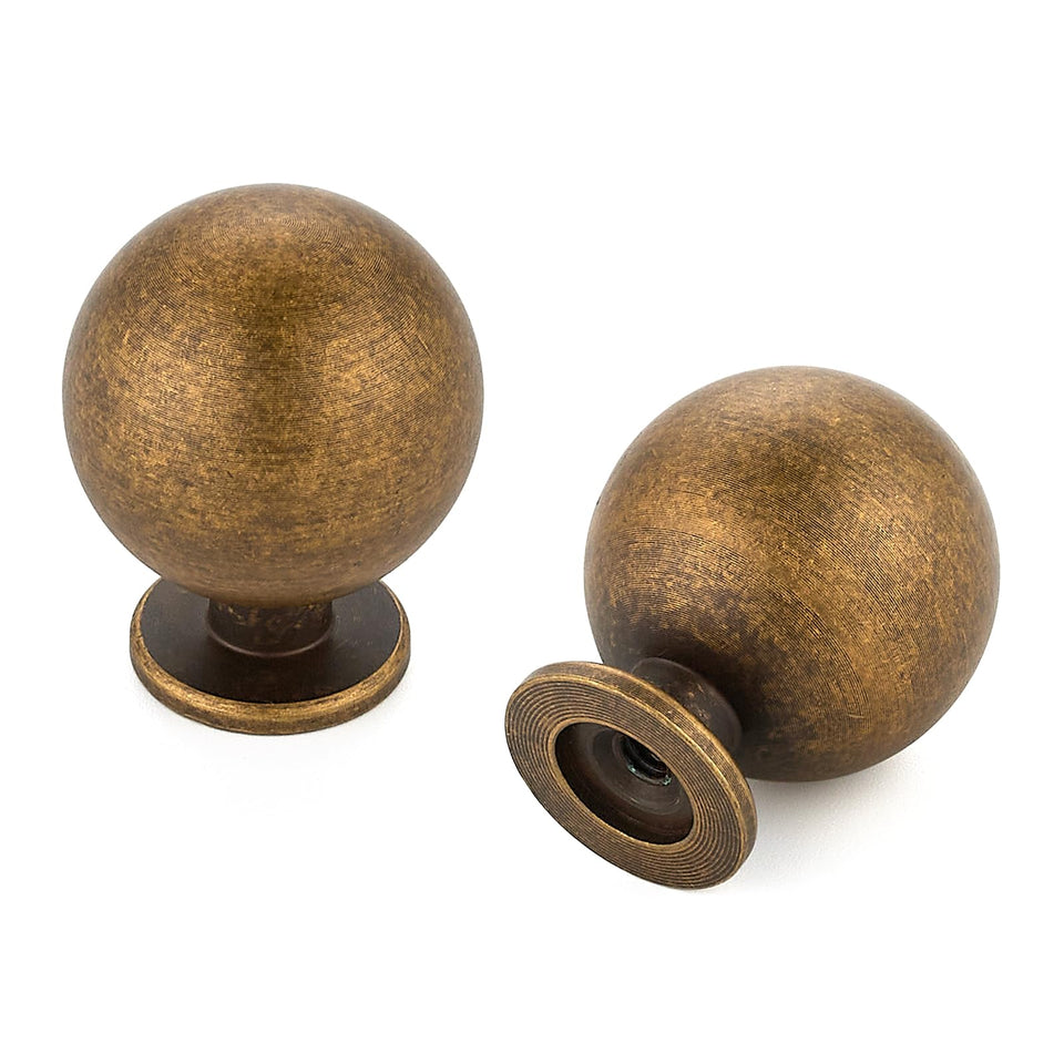 Ravinte Decor antique brass knob on a round 1-inch face, ideal for refreshed cabinets.