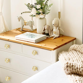 Ravinte Decor round base knob on drawer front suggests timeless vintage appeal and smooth operation