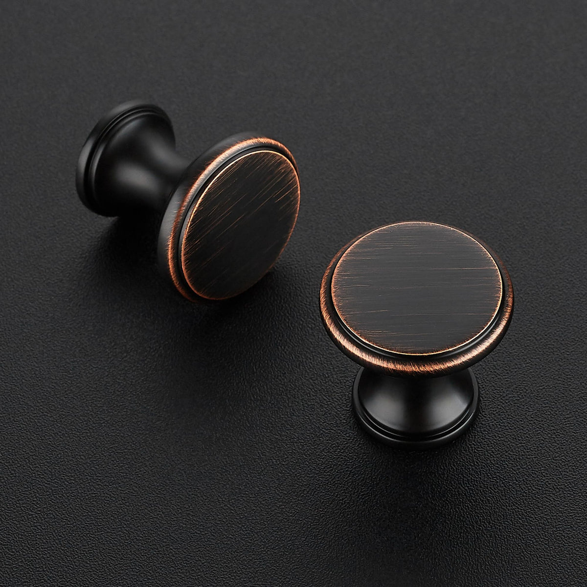 Ravinte glazed round bronze knob close-up shows polished finish.