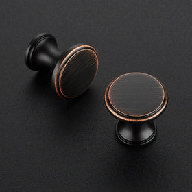 Ravinte glazed round bronze knob close-up shows polished finish.