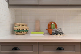 Ravinte half-moon cup pulls offer contemporary flair on drawers.