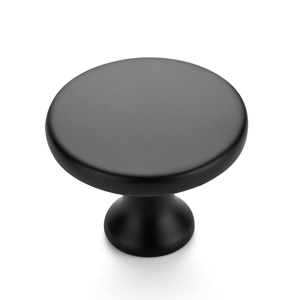 Ravinte matte black round knob close-up showing premium zinc durability for cabinets.