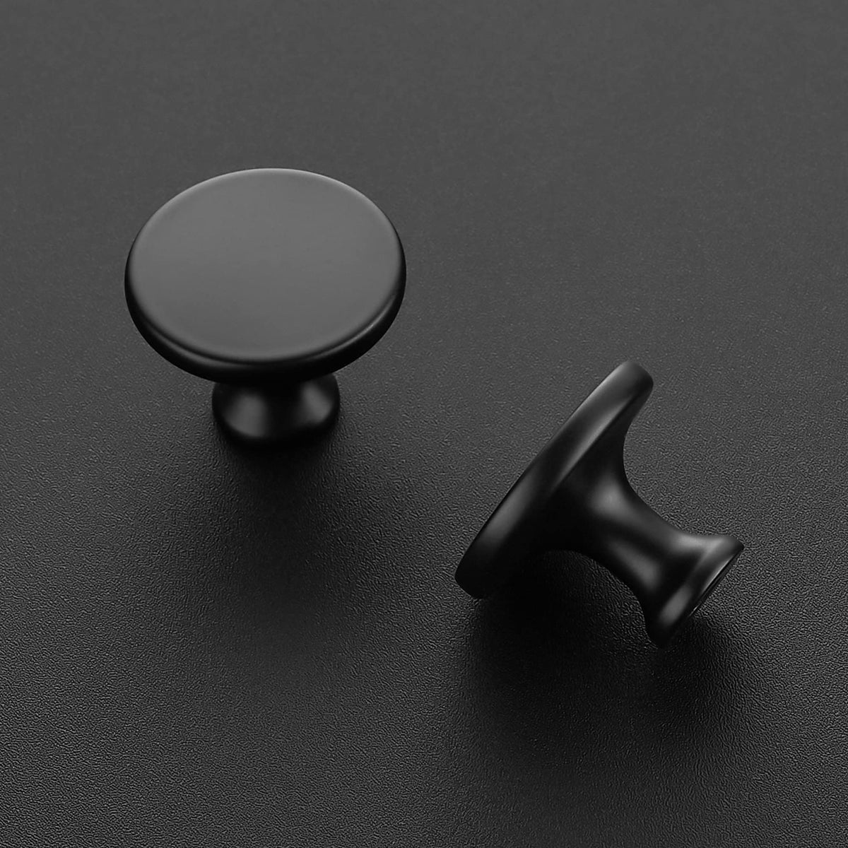 Ravinte matte black round knob mounted on a cabinet for a modern update.