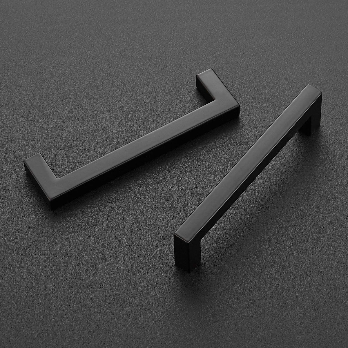 Close-up of Ravinte matte black square drawer pulls showing sleek edges.