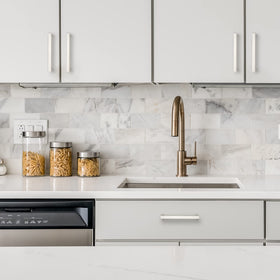 Ravinte modern brushed nickel handle installed on a cabinet.