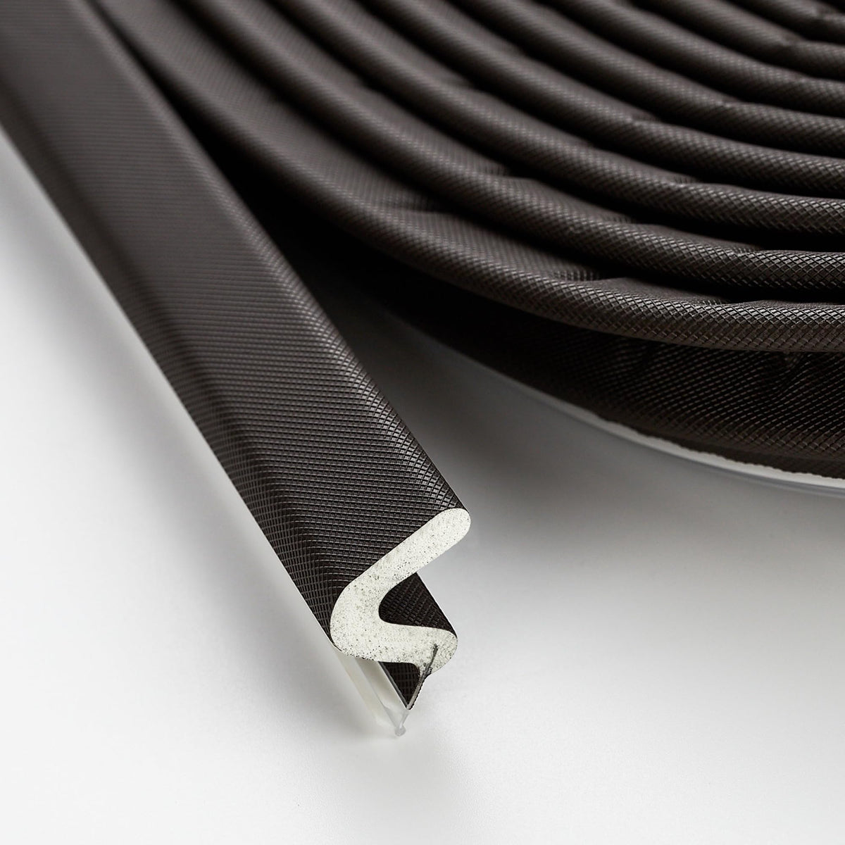 Ravinte weather-stripping door seal in brown blocks drafts and improves comfort at the doorway