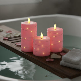 Raycare pink decor candles on a wedding table setting