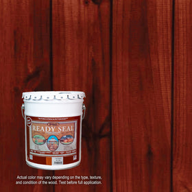 Ready Seal brush applying stain on wood deck highlights grain