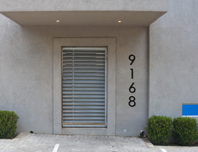 REINCARVATION outdoor address plaque ships with hardware for quick setup.