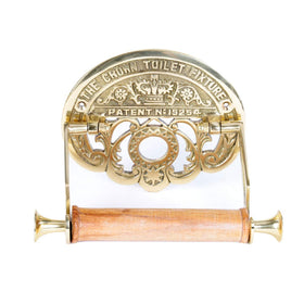Renovators Brass wall-mount toilet paper holder with crown design for elegant bathroom organization.