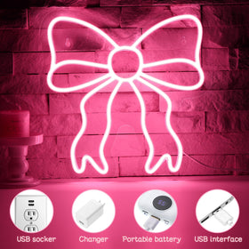 Retisee pink bow neon sign in dorm room creating inviting ambiance