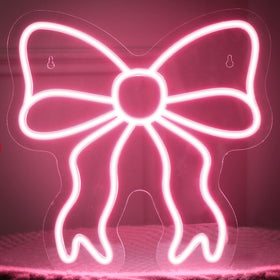 Retisee pink bow neon sign wall-mounted adds soft glow and chic ambiance