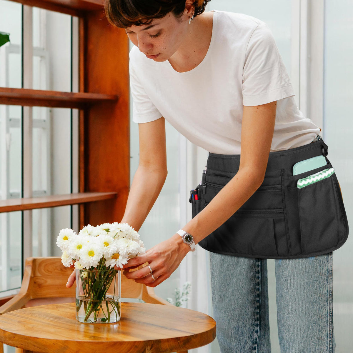 Black Rexmica server apron complements professional kitchen uniforms.