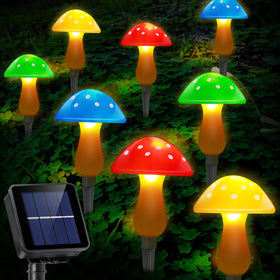 ReyeeInc solar garden mushroom light glows along a garden path for warm nighttime ambiance.
