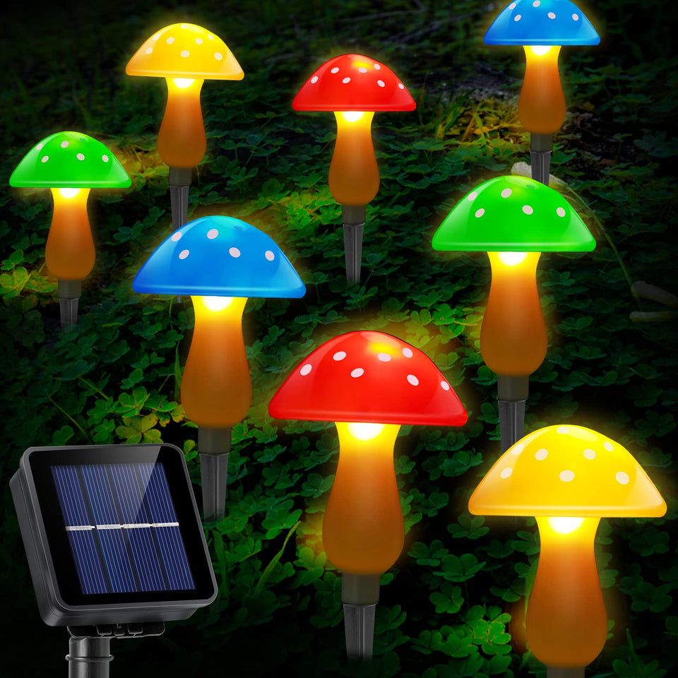 ReyeeInc solar garden mushroom light glows along a garden path for warm nighttime ambiance.