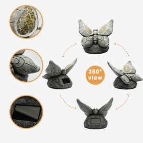 Rezpuao resin butterfly ornament, patio setting, weatherproof and durable.
