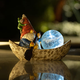 Rezpuao solar light gnome illuminates pathways after sunset with energy-saving glow.