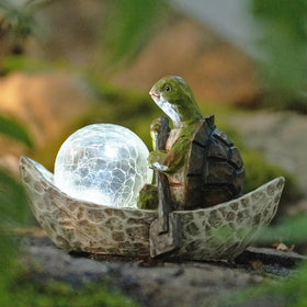 Rezpuao solar-lit turtle sculpture creates ambient backyard lighting.