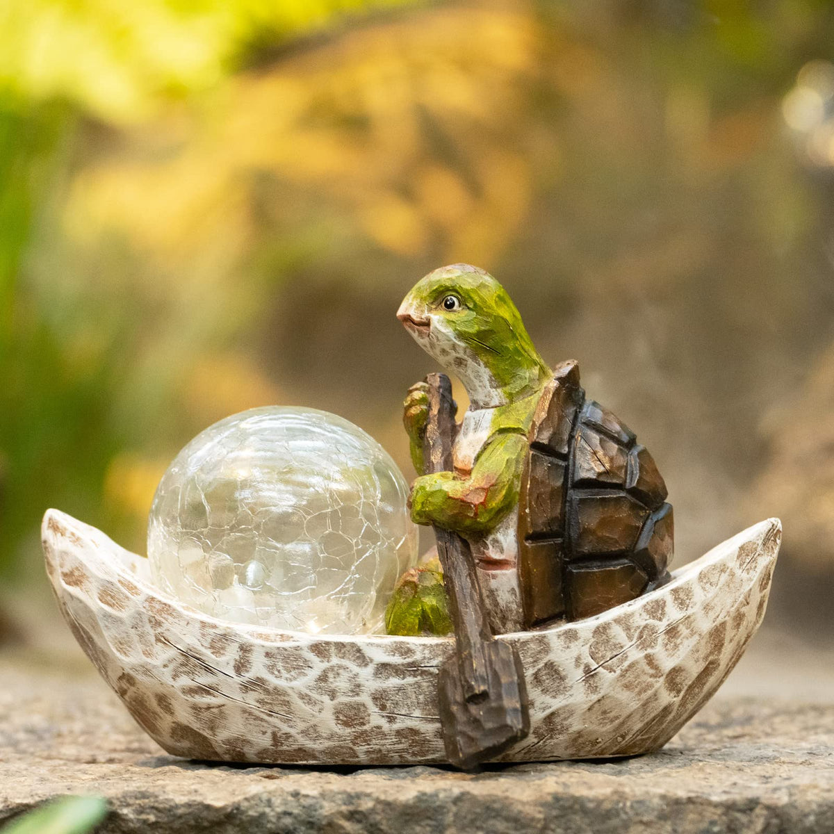 Rezpuao solar turtle garden decor lights up softly at night.