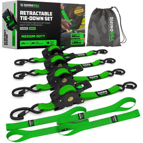 Rhino USA retractable ratchet strap in green securing cargo on a truck bed.