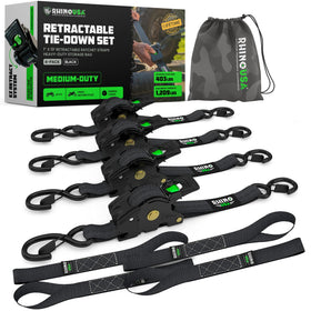 Rhino USA retractable ratchet straps in action securing cargo on a trailer.