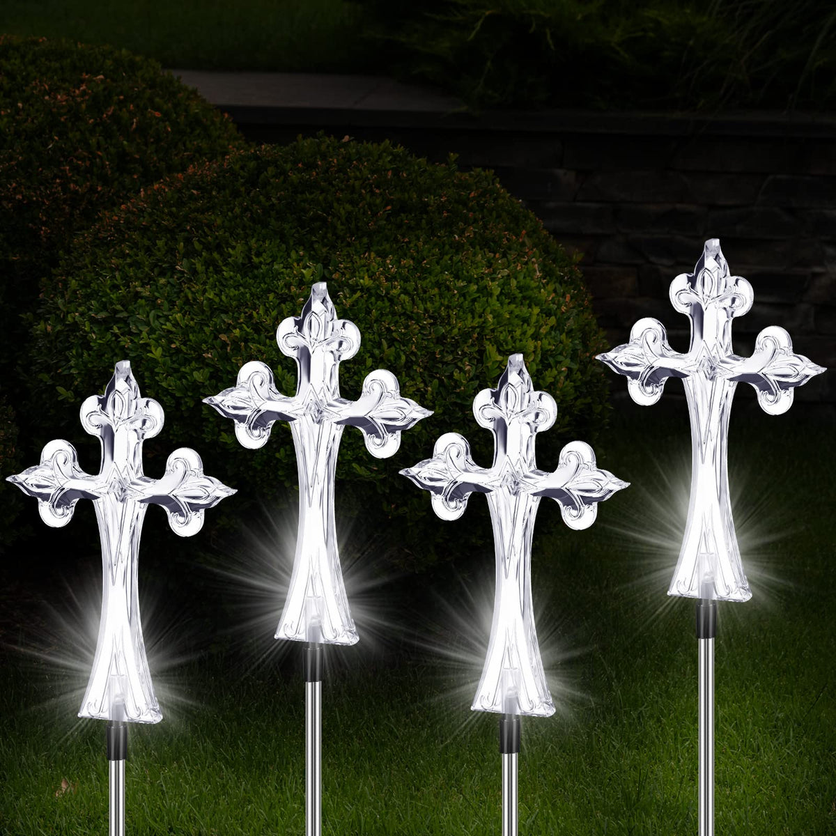Riakrum solar cross grave display casting a gentle glow at dusk