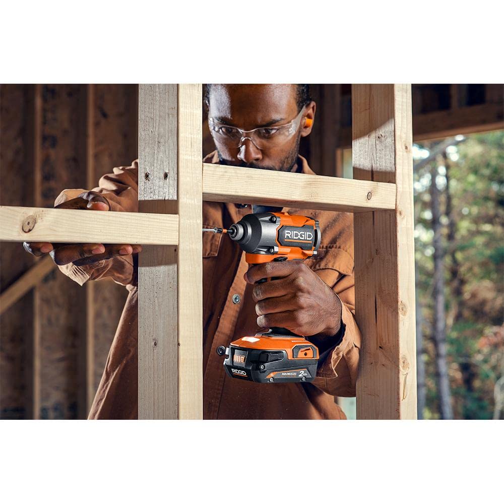 RIDGID 18V brushless impact driver in workspace shows portability and efficiency.