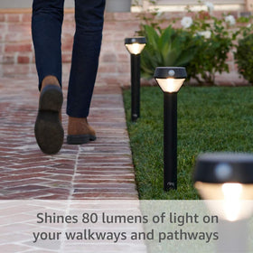 Ring Solar Pathlight installation view showing quick, tool-free setup outdoors.