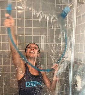 Rinseroo mess-free wall rinse demonstrates easier shower wall cleaning.