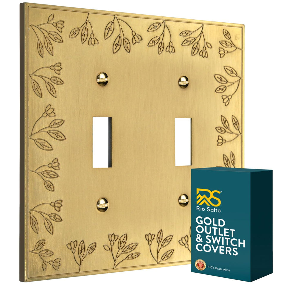Rio Salto floral collection double toggle cover plate in brushed brass adds elegant, durable style.